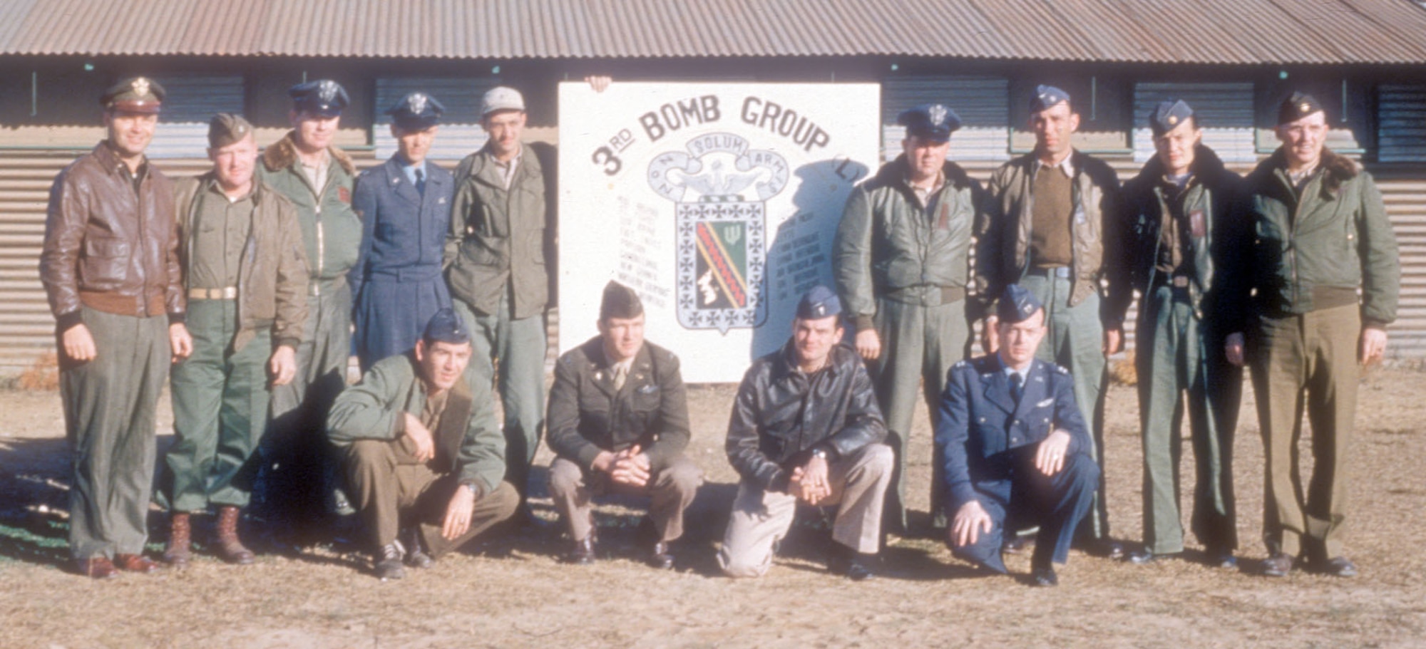 The varied uniforms in this photograph illustrate the USAF in transition during the Korean War. Some wear the old uniform of the U.S. Army Air Forces (USAAF) while others wear newly issued USAF blues or a combination of both. (U.S. Air Force photo)