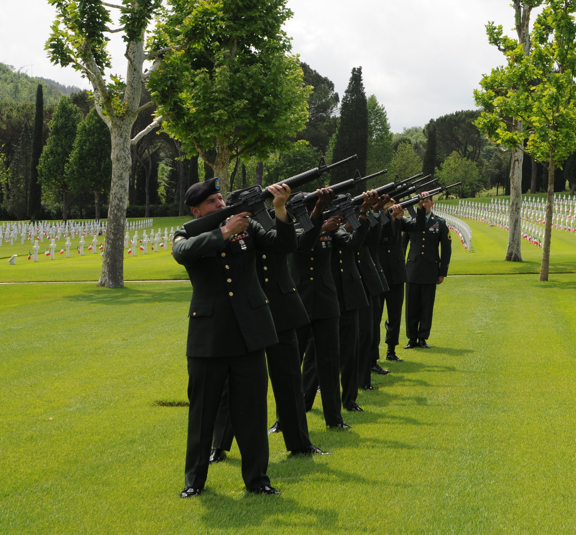 The Vicenza Firing Team performs a 21-gun salute during the Memorial Day service held at the Florence American Cemetery. The ceremony is held annually to remember the 4,402 servicemembers who are buried at the cemetery in Florence, Italy. (U.S. Air Force photo/2nd Lt. Brian Wagner)