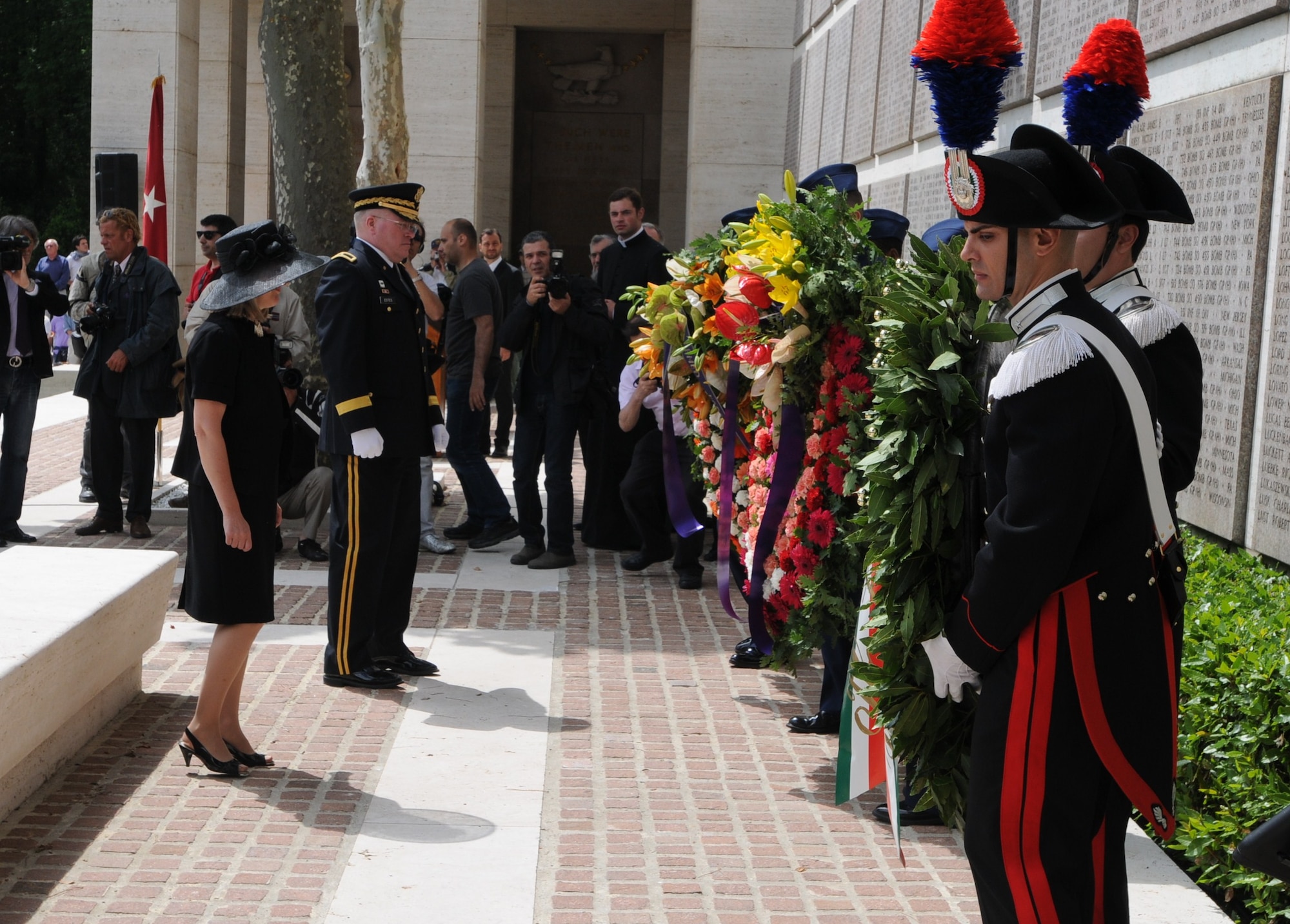 Mary Ellen Countryman, Florence Consulate General, and Brig. Gen. Charles D. Estes, U.S. Army V Corps chief of staff, stand in front of the wreaths during a Memorial Day ceremony May 31 at the Florence American Cemetery. Both spoke at the ceremony, which honored the men and women buried at the cemetery in Florence, Italy. (U.S. Air Force photo/2nd Lt. Brian Wagner)