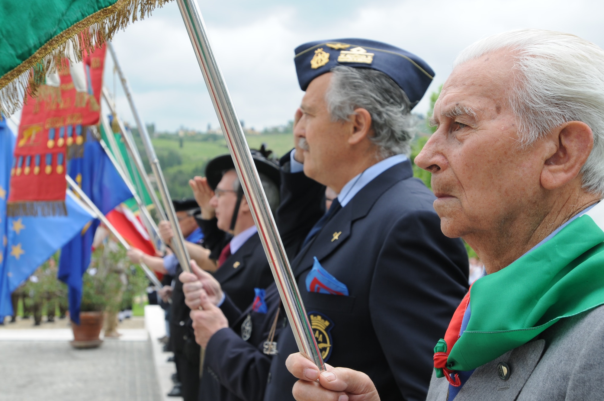 Representatives from Italian veterans’ associations pay their respects to U.S. servicemembers who are buried at the Florence American Cemetery during the Memorial Day ceremony May 31, 2010.  The memorial service included speeches, a wreath laying ceremony and a 21-gun salute. (U.S. Air Force photo/2nd Lt. Brian Wagner)