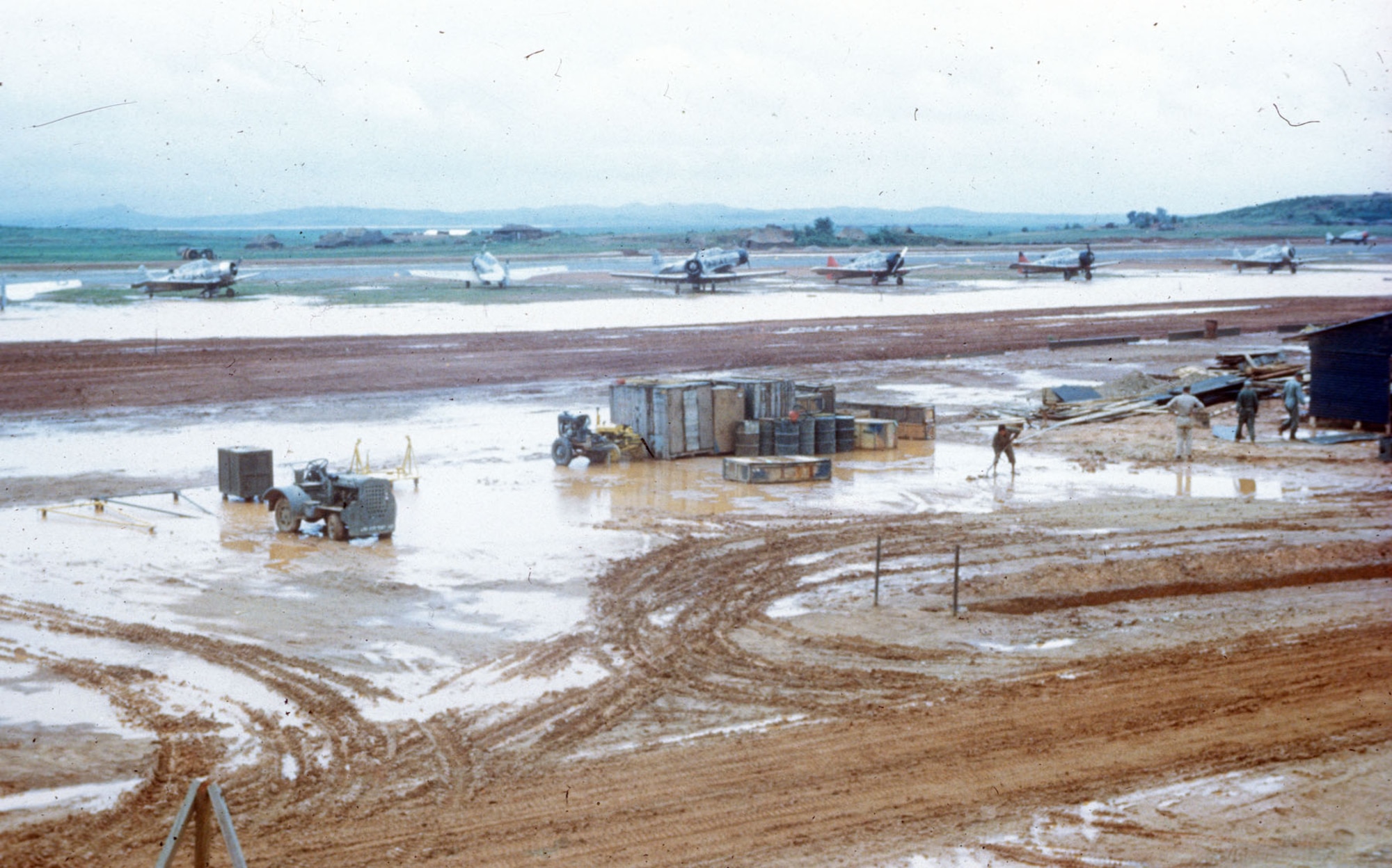 K-6 (Pyongtaek) flooded after a heavy rain in the summer of 1951. This created problems that could affect flying operations. The Airman who took this image appropriately labeled it “Dust to Mud.” (U.S. Air Force photo)