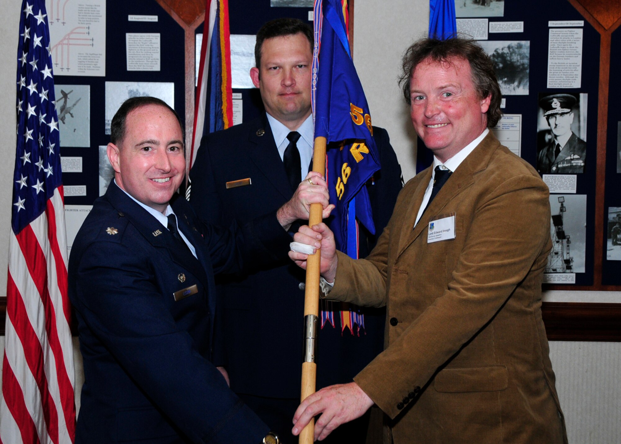 Lord Edward Iveagh, The Right Honourable Earl of Iveagh, Deputy Lieutenant, assumes honorary command of the 56th Rescue Squadron from Lt. Col. Neil Eisen, 56th RQS commander, during a ceremony June 4 at Eagles Landing. (U.S. Air Force photo/Airman 1st Class Eboni Knox)