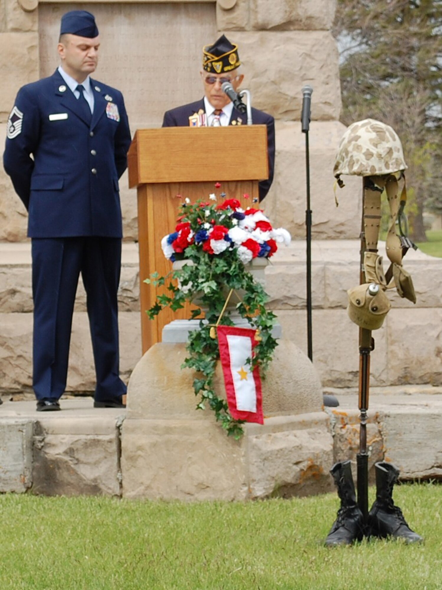 Sam Pappas, master of ceremonies, and Senior Master Sgt. Albert Robin, 819th RED HORSE Squadron airfields resources superintendent, list off the names of all veterans who died between May 1, 2009 to May 1, 2010 during Roll Call at the 142nd Annual Memorial Day Program May 31. (U.S. Air Force Photo/Airman 1st Class Kristina Overton)