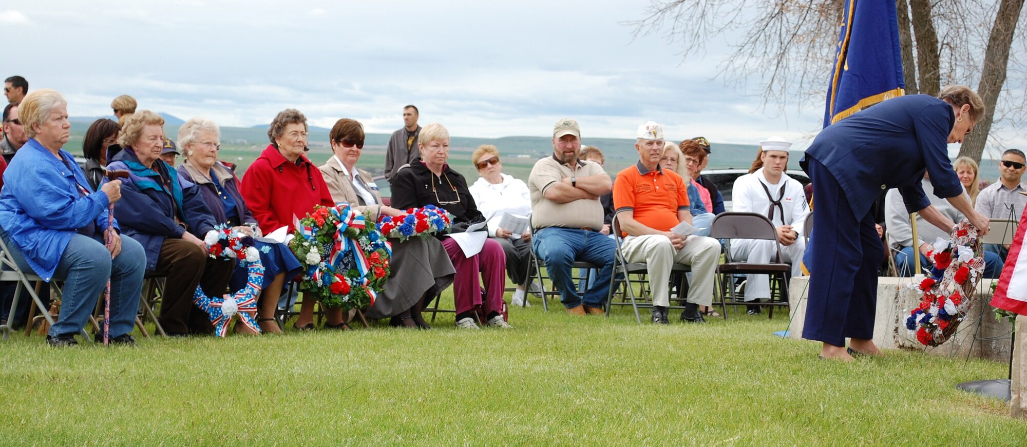 Ladies of the Veteran Organization Auxiliaries presented wreaths at the annual Memorial Day Program on behalf of the members of each of their respective groups in honor of their service. The ceremony took place at Highland Cemetery May 31. (U.S. Air Force Photo/Airman 1st Class Kristina Overton)