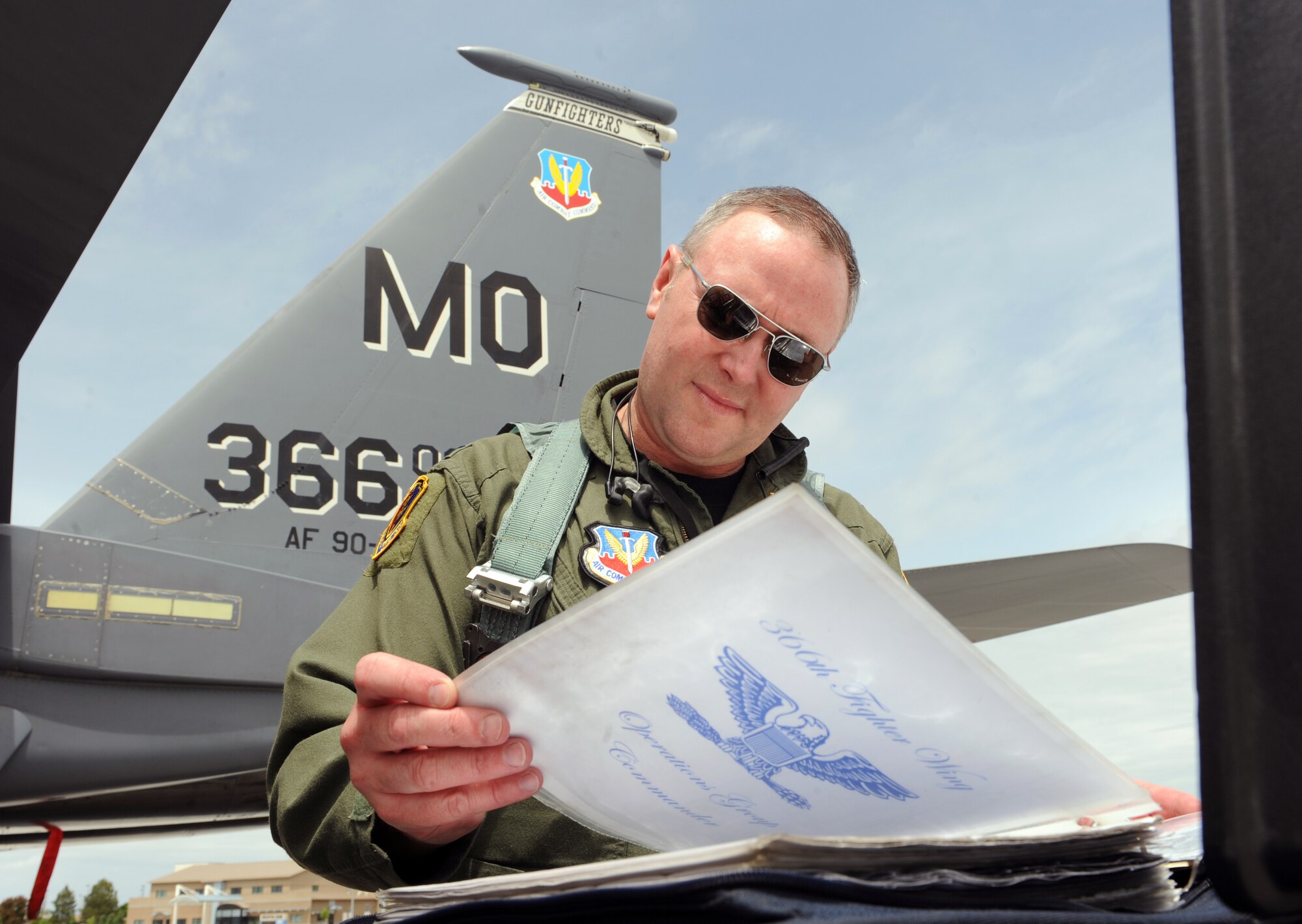 MOUNTAIN HOME AIR FORCE BASE, Idaho – Col. James McGovern, 366th Operations Group commander, reviews documents before taking his final flight June 2. Colonel McGovern has been selected as the 607th Air and Space Operations Center commander at Osan Air Base, Korea. (U.S. Air Force photo by Airman 1st Class Debbie Lockhart)