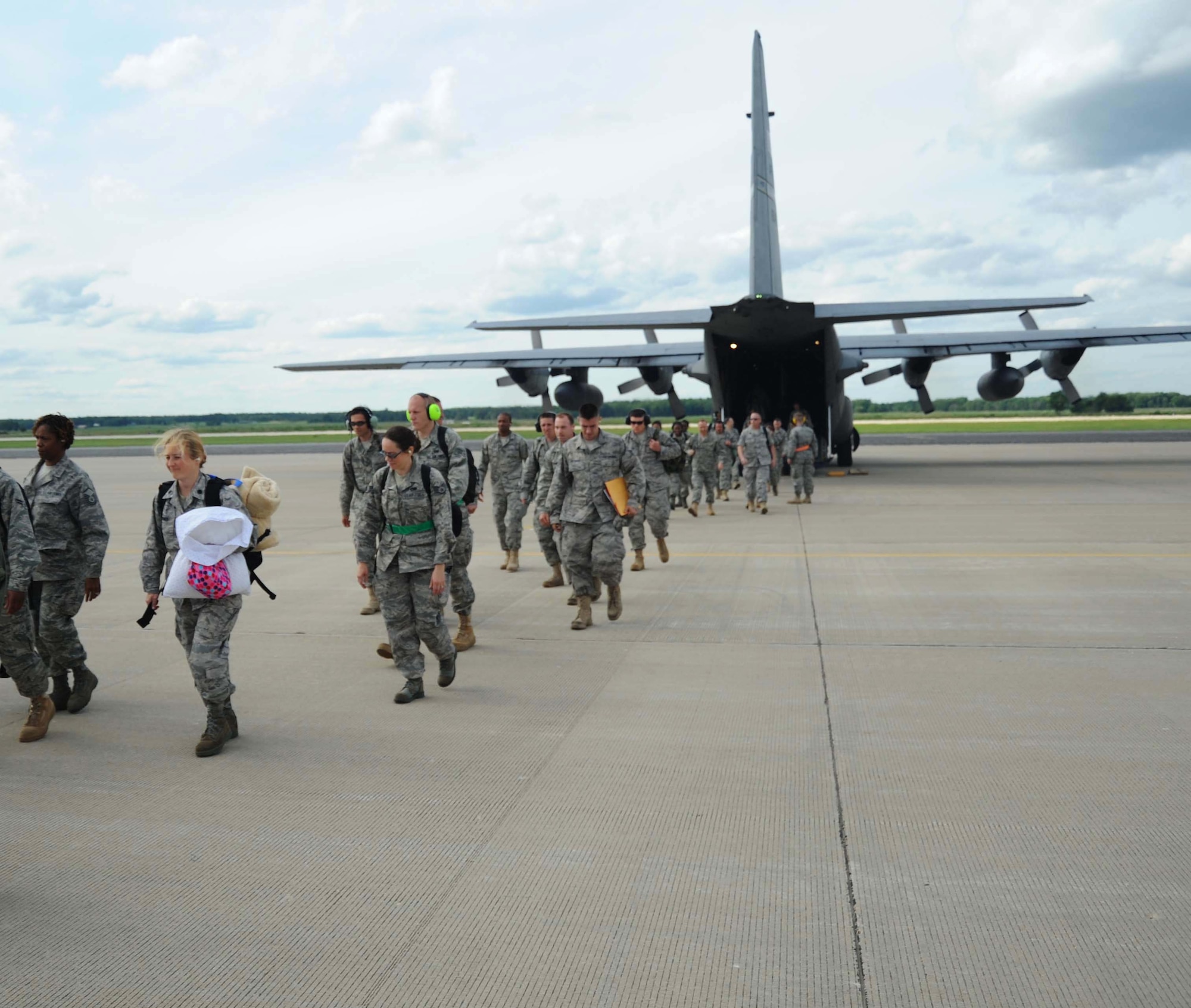 First arrivals from Pope Air Force Base deplane from  a 440th Airlift Wing C-130 at Volk Field.  Many of the Reservists are part of the advanced team who will prepare the Volk Field training site for ORTP IV. Joining the 440th team will be members of the 916th Air Refueling Wing and the 71st Aerial Port Squadron. More than 400 Reservists will be at Volk Field for the next  five days practicing the skills required to successfully pass the upcoming Operational Readiness Inspection early next year. (Air Force photo by Jerry Green)