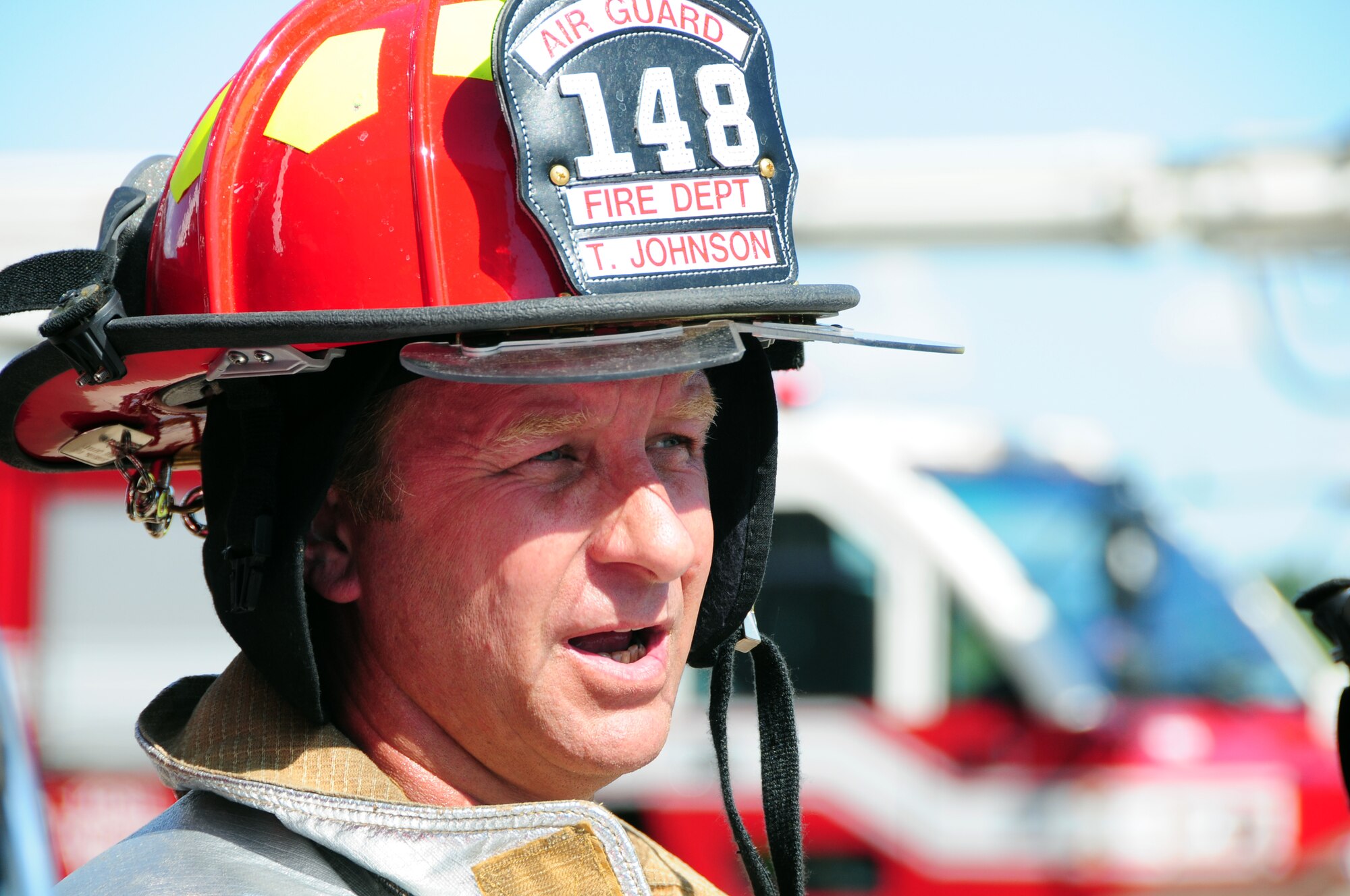 U.S. Air National Guard Fire Fighter Tom Johnson, 148th Fighter Wing, talks with reporters after a Major Accident Response Exercise (MARE) of a commercial airliner crash at the  Duluth International Airport, Minn., June 3, 2010. The MARE was held in conjunction with local, state and federal emergency response agencies to test and validate emergency response capabilities. (U.S. Air Force photo by Master Sgt. Jason W. Rolfe/Released)