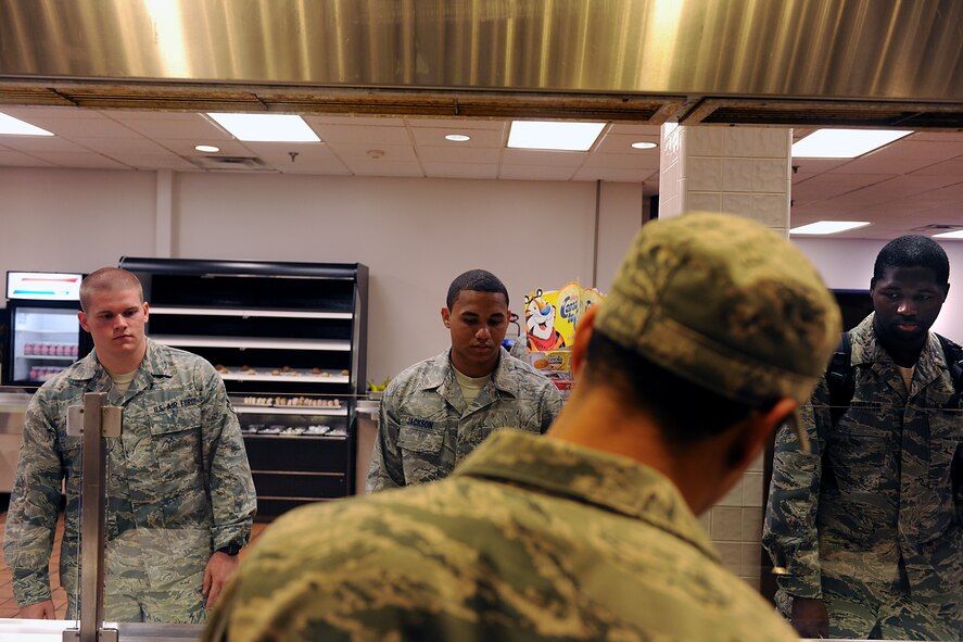 MOODY AIR FORCE BASE, Ga. -- Airman 1st Class Thomas Lynch, 23rd Operations Support Squadron air traffic controller, Airman 1st Class Samuel Jackson, 23rd Operations Support Squadron air traffic controller, and Senior Airman Andrew Washington, 23rd Operations Support Squadron material management Journeyman wait for their omelets or scrambled eggs at the dining facility here May 25. Airmen have a choice of scrambled eggs, omelets, and hard or over easy. (U.S. Air Force photo by Airman 1st Class Joshua Green/RELEASED)