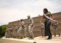Mrs. La Vernia Cynthia Hinojosa dances with trainees during the Memorial Day Jam May 30. (U.S. Air Force photo/Robbin Cresswell) 