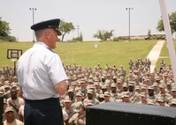 Col. William H. Mott V, 37th Training Wing commander, welcomes Airmen to the Memorial Day Jam May 30. The event featured a volleyball, flag football and basketball. Volunteers served burgers, hot dogs, ice cream, and an assortment of beverages to battle the summer heat. (U.S. Air Force photo/Robbin Cresswell)