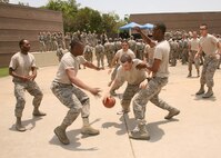 Air Force basic military trainees play basketball during the Memorial Day Jam. (U.S. Air Force photo/Robbin Cresswell)