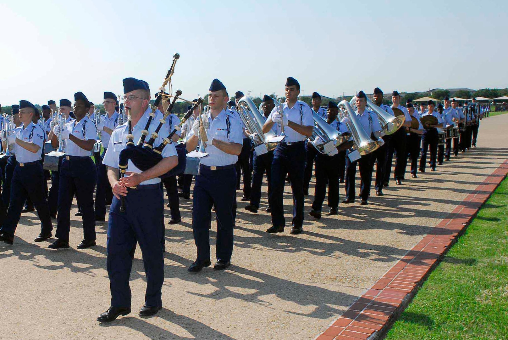 Airman Adam Tianello, 323rd Training Squadron, plays the bagpipes with the band flight during the Air Force Basic Military Training graduation parade May 28. (U.S. Air Force photo/Alan Boedeker)