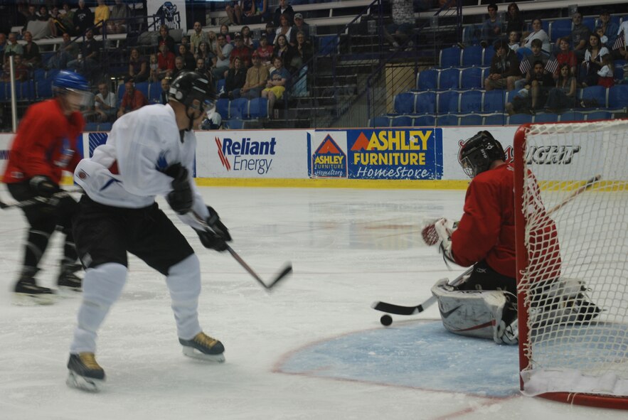 During the 2010 Memorial Day Hockey Classic at the NYTex Sports complex in North Richland Hills, Texas, the Navy/Marine team opened a first period 5-1 lead, but the Army/Air Force team caught up by the end of the second period. Although a evenly-matched contest, the Navy/Marine team decisively won 10-5. (U.S. Air Force Photo/SrA Jeremy Roman)