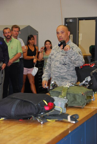 TSgt Juan Duharte, a life support specialist with the 920th Rescue Wing at Patrick Air Force Base, Fla., explained the tools of his trade to employers and base leadership  during an ESGR joint Bosslift May 6. Employers joined leadership from Naval Air Station Fort Worth Joint Reserve Base and members of Texas Employer Support of the Guard and Reserve for a joint “Bosslift” to Air Force and Navy installations in Florida. (U.S. Air Force Photo/SrA Jeremy Roman)