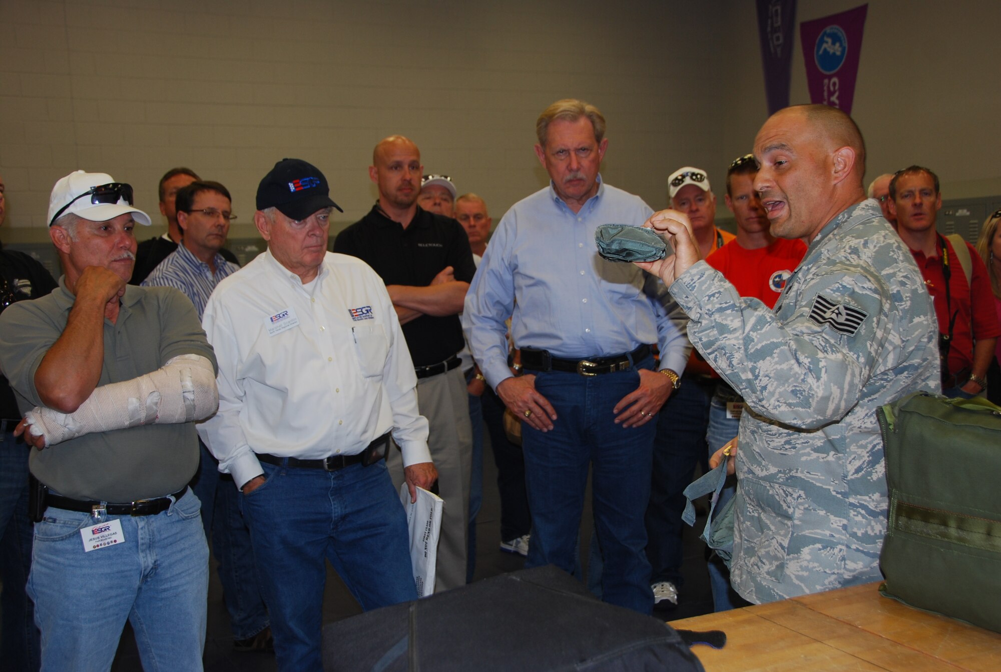 TSgt Juan Duharte, a life support specialist with the 920th Rescue Wing at Patrick Air Force Base, Fla., explained the tools of his trade to employers and base leadership  during an ESGR joint Bosslift May 6. Employers joined leadership from Naval Air Station Fort Worth Joint Reserve Base and members of Texas Employer Support of the Guard and Reserve for a joint “Bosslift” to Air Force and Navy installations in Florida. (U.S. Air Force Photo/SrA Jeremy Roman)