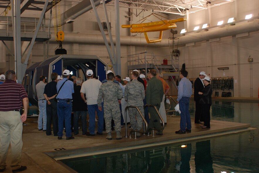 Employers from the Dallas/Fort Worth area and base leadership visited a Navy helicopter training “dunk tank” at Naval Air Station Pensacola May 5. Employers experienced many joint training  areas during a joint “Bosslift” to Air Force and Navy installations in Florida. (U.S. Air Force Photo/Laura Dermarderosiansmith)
