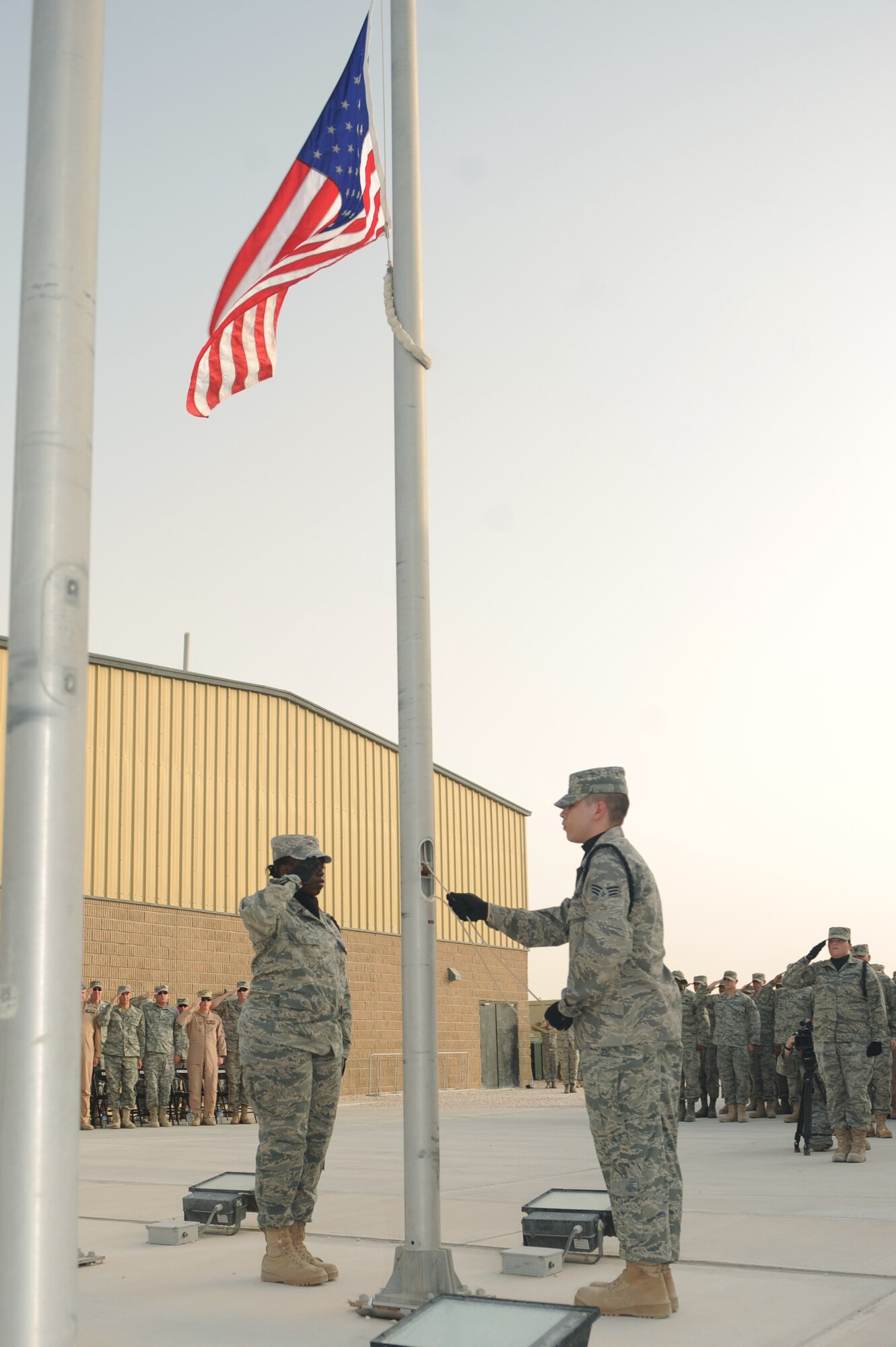 Base servicemembers pay tribute to fallen warriors during a Memorial Day retreat ceremony at a non-disclosed Southwest Asia location, May 31, 2010. (U.S. Air Force photo by Tech. Sgt. Michelle Larche)[RELEASED]