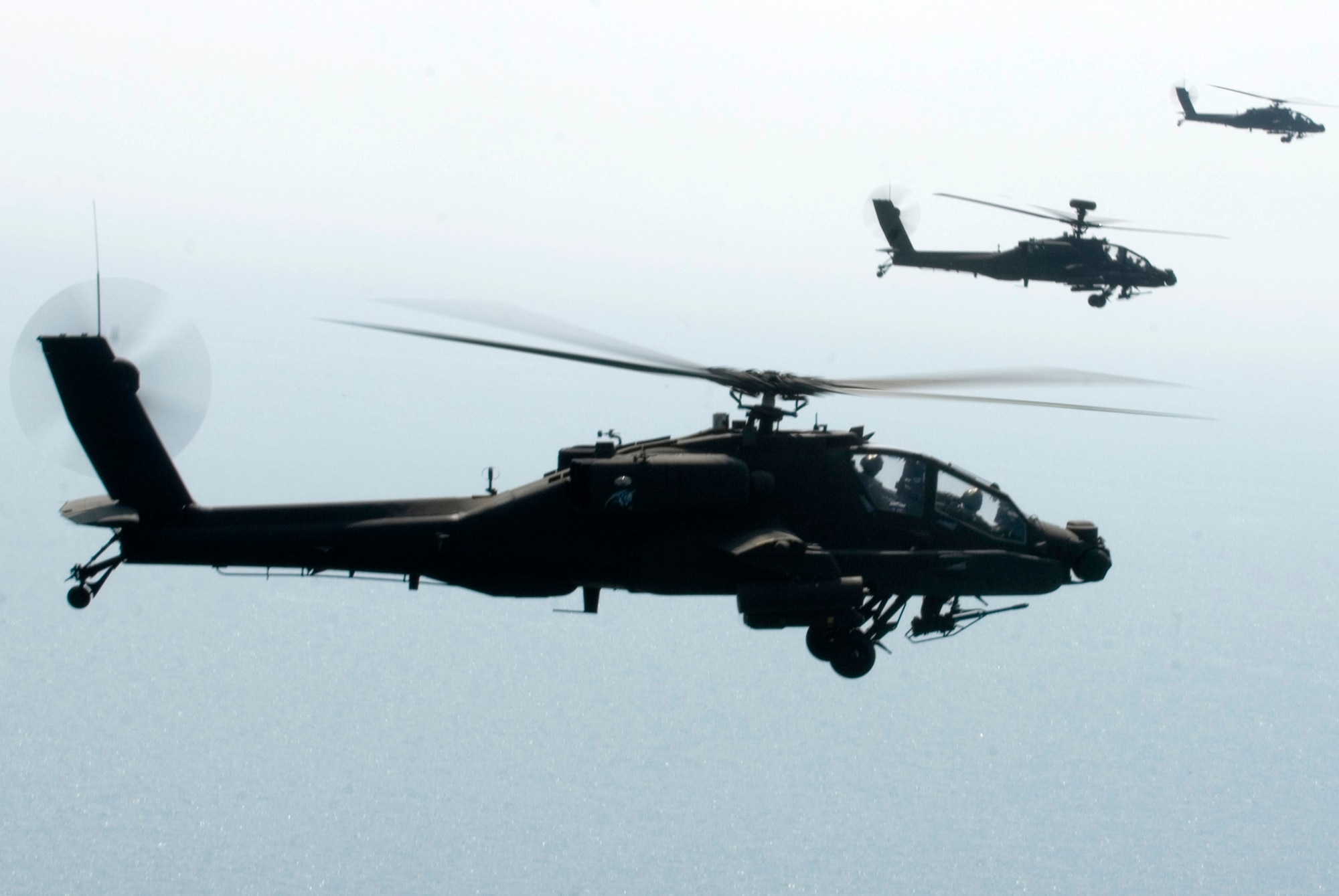 KUNSAN AIR BASE, Republic of Korea -- Three AH-64 Apache helicopter assigned to the 4-2 Attack Battalion, Camp Humphreys, Republic of Korea, sets to fire Hellfire missiles toward a target at an air-ground range  20 miles outside of Kunsan Air Base during a Joint Air Attack combat readiness training session, June 3.  Several Apache crews fired Hellfire missiles, 30mm rounds  and rockets during the four day training mission. Overall, a total of 155 Hellfire missiles, 152 HE 2.75 inch rockets, 50 illumination 2.75 inch rockets, 1,560 rounds of 30 mm HE rounds  were fired by the 26 Apache crews involved in the training. "The exercise provided valuable joint air attack team training and enhanced combat readiness," said Maj. Kyle Armstrong, 8th Operations Support Squadron assistant director of operations. (U.S. Air Force photo/Staff Sgt. Jonathan Pomeroy)