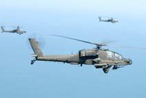 KUNSAN AIR BASE, Republic of Korea -- Three AH-64 Apache helicopters assigned to the 4-2 Attack Battalion, Camp Humphreys, Republic of Korea, get ready to fire Hellfire missiles towards a target at an air-ground range,  20 miles outside of Kunsan Air Base, during a Joint Air Attack combat readiness training session, June 3.  Several Apache crews fired Hellfire missiles, 30mm rounds  and rockets during the four day training mission. Overall, a total of 155 Hellfire missiles, 152 HE 2.75 inch rockets, 50 illumination 2.75 inch rockets, 1,560 rounds of 30 mm HE rounds  were fired by the 26 Apache crews involved in the training. "The exercise provided valuable joint air attack team training and enhanced combat readiness," said Maj. Kyle Armstrong, 8th Operations Support Squadron assistant director of operations. (U.S. Air Force photo/Staff Sgt. Jonathan Pomeroy)