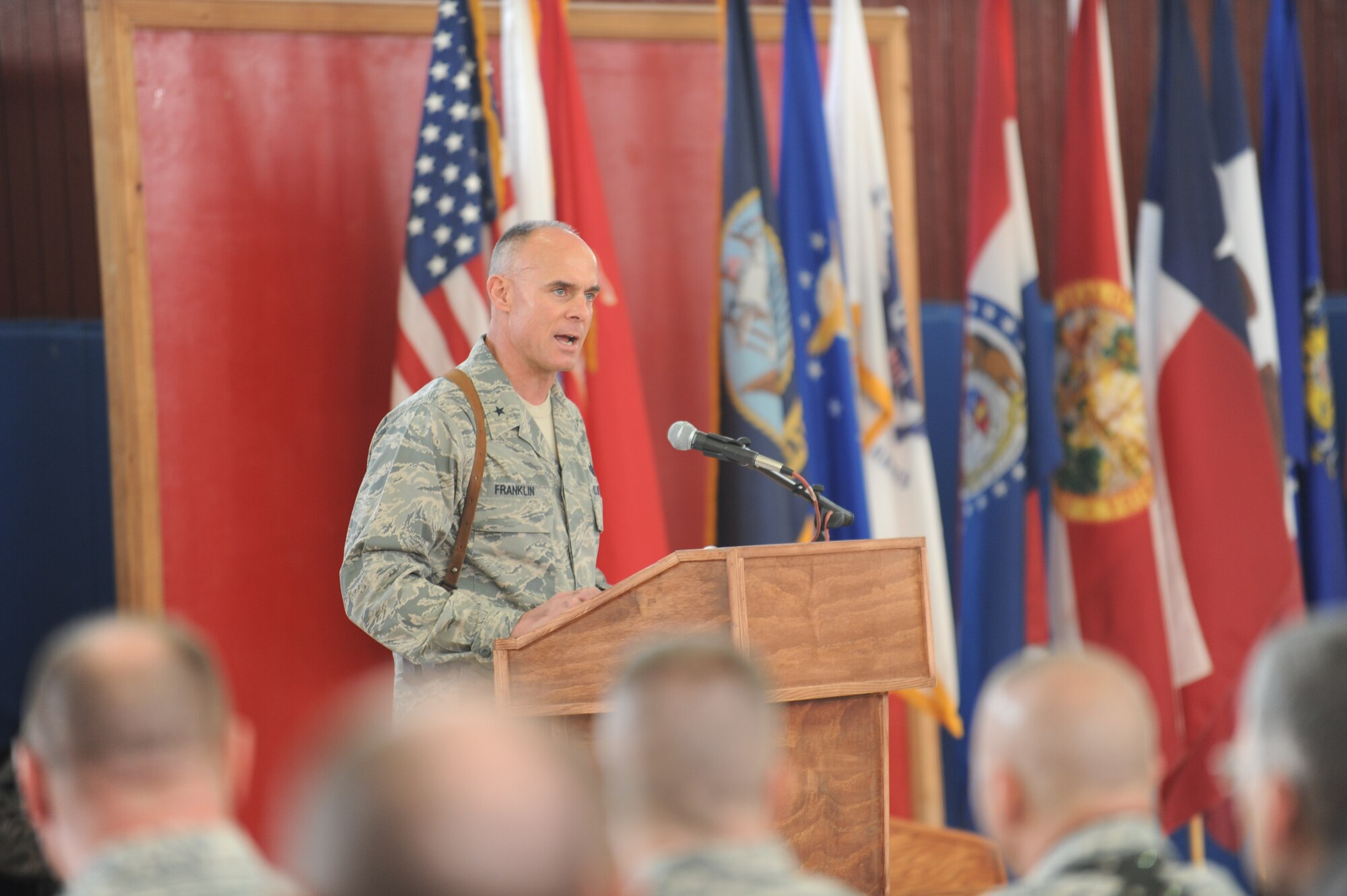 Brig. Gen. Craig A. Franklin, 332nd Air Expeditionary Wing Commander, gives opening remarks, during the Memorial Day ceremony at Joint Base Balad, Iraq, May 31, 2010. The ceremony consisted of the unveiling of a mini T-wall memorial, musical performances, reading of the proclamation from President Obama, and guest speakers representing the Air Force, Navy, Coast Guard, and Army sharing stories of fellow personnel that made the ultimate sacrifice for their nation.  (U.S. Air Force photo/Master Sgt. Linda C. Miller)


