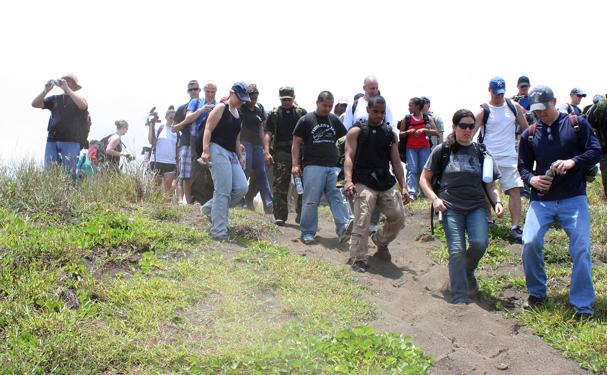 Kadena Airmen and Marines take the opportunity to tour the sites and monuments on the island of Iwo Jima, May 28. Mr. D’Angina, 353d Special Operations Group historian and Dr. Ian Spurgeon, 18th Wing historian, gave the Airmen and Marines a better perspective of the historical conflict in the Pacific theater as they toured through the caves, tunnels, the airfield, and the most prominent feature of the island, Mount Suribachi.  (Courtesy photo)    