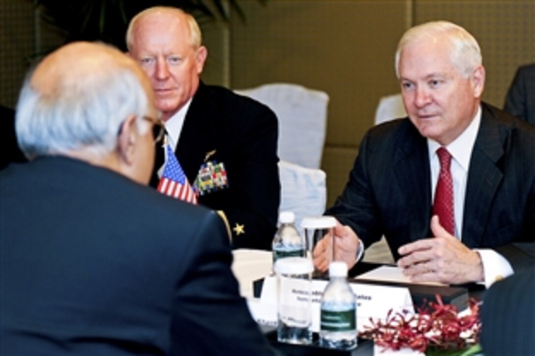 U.S. Defense Secretary Robert M. Gates, right, and Navy Adm. Robert Willard, commander of U.S. Pacific Command, hold a bilateral meeting with India's National Security Advisor Shiv Shankar Menon during the 9th International Institute for Strategic Studies Security Summit: The Shangri-La Dialogue, Singapore, June 4, 2010.