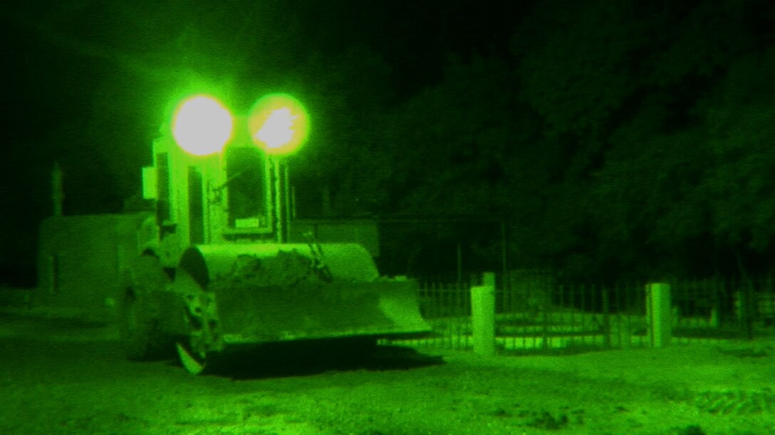 A Marine with 9th Engineer Support Battalion, 1st Marine Logistics Group (Forward), flattens a road with a steamroller in Marjah, Afghanistan, June 4. These engineers are improving the roads in Marjah to make it easier and safer for Marines and Afghans to travel through Helmand province.