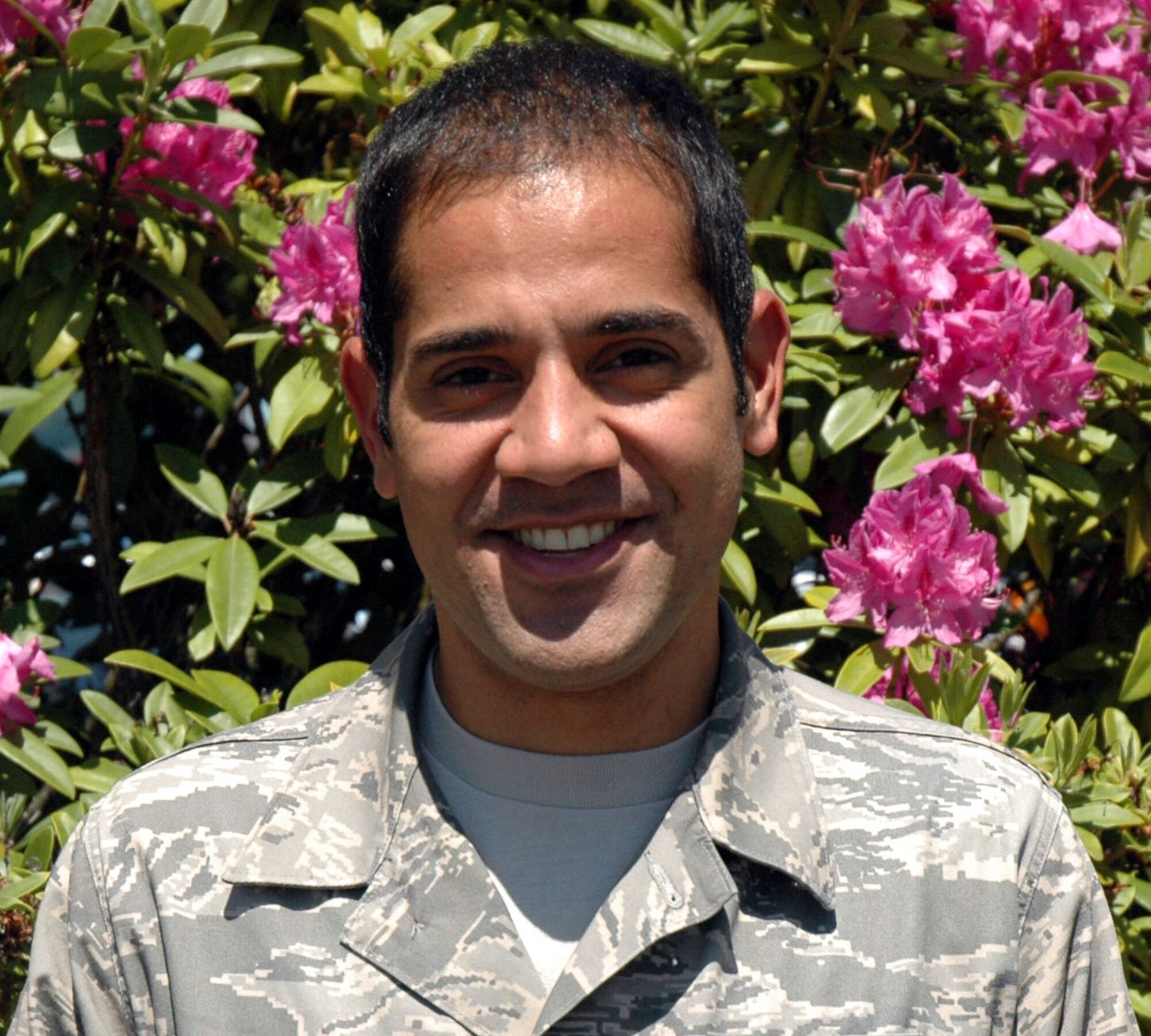 JOINT BASE LEWIS-MCCHORD, Wash. -- Senior Airman Carlos Seoanes-Perla, 446th Aircraft Maintenance Squadron, recently returned from Lima, Peru, where he was deployed as an interpreter for high-level military personnel and VIPs. The Bothell, Wash., resident is an information management administrator for the 446th AMXS, and grew up in the same Colombian town as latin pop music star Shakira. (U.S. Air Force photo/Staff Sgt. Grant Saylor)