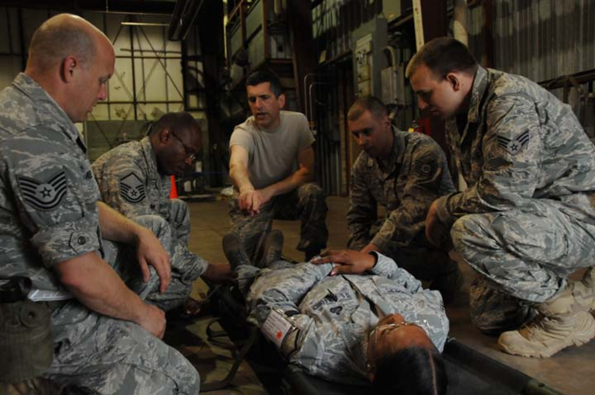 Airmen from the 916th Air Refueling Wing and 440th Airlift Wing receive training on how to carry a medical litter during Operation Readiness Safeguard at Volk Field, Wisconsin. (USAF photo by TSgt. Scotty Sweatt, 916ARW/PA)