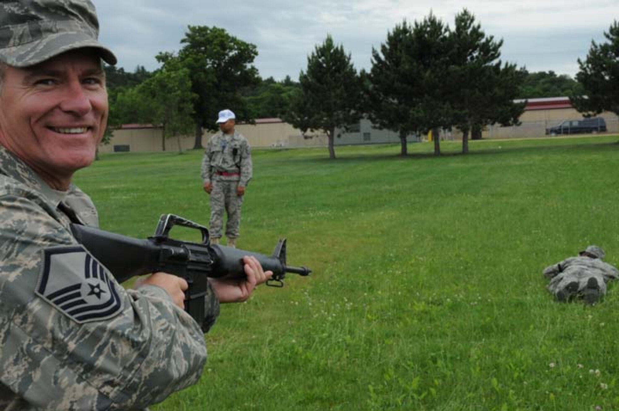 Master. Sgt. Jay Stallard gives a smile to the camera before proceeding to challenge an intruder during a field exercise at Volk Field, Wisconsin. Sgt. Stallard is a Reservist with the 916th Mission Support Group. (USAF photo by TSgt. Scotty Sweatt, 916ARW/PA)