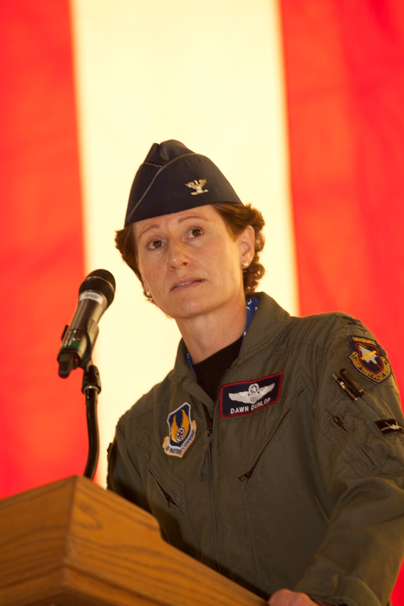 Col. Dawn Dunlop speaks to more than 400 Edwards AFB personnel after assuming command of the 412th Test Wing June 4.  (Air Force photo by Greg L. Davis)