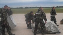 916th Air Refueling Wing leadership demonstrates how to properly cover and uncover contaminated equipment during a training session on Saturday June 5 at Volk Field, Wisconsin. More than 600 Airmen from the 916th ARW and 440th Airlift Wing, and other units, participated in Operation Readiness Safeguard. (USAF photo by Maj. Shannon Mann, 916ARW/PA)
