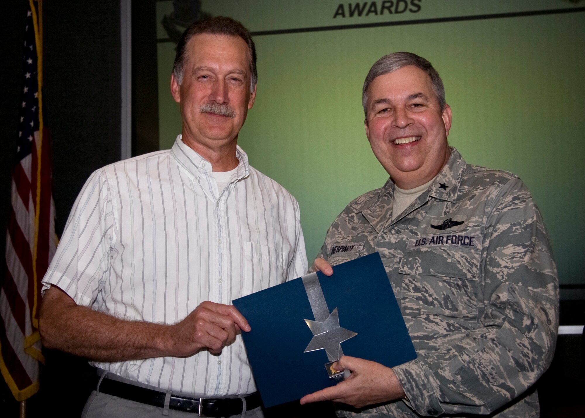 GRISSOM AIR RESERVE BASE, Ind. -- John Robison, a supervisory general engineer with the 434th Civil Engineer Squadron, is recognized for 30 years of federal service by Brig. Gen. Dean Despinoy. (U.S. Air Force photo/Tech. Sgt. Mark R. W. Orders-Woempner)