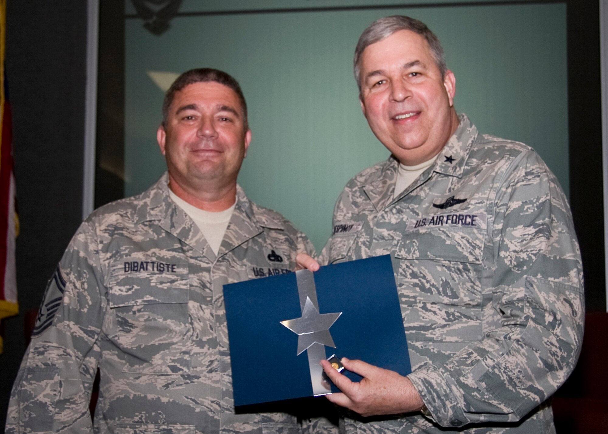 GRISSOM AIR RESERVE BASE, Ind. -- Senior Master Sgt. George Dibattiste, a systems flight supervisor with the 434th Maintenance Squadron is recognized for 30 years of federal service by Brig. Gen. Dean Despinoy. (U.S. Air Force photo/Tech. Sgt. Mark R. W. Orders-Woempner)
