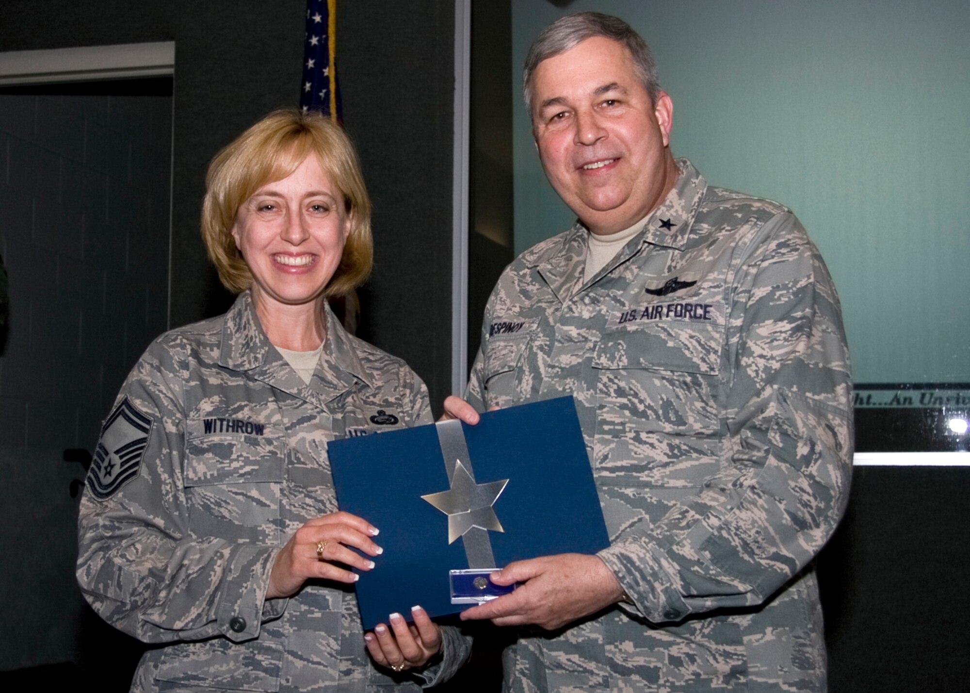 GRISSOM AIR RESERVE BASE, Ind. -- Senior Master Sgt. Juanita Withrow, 434th Mission Support Flight superintendent, poses for a photo with Brig. Gen. Dean Despinoy after being recognized for 20 years of federal service.  (U.S. Air Force photo/Tech. Sgt. Mark R. W. Orders-Woempner)