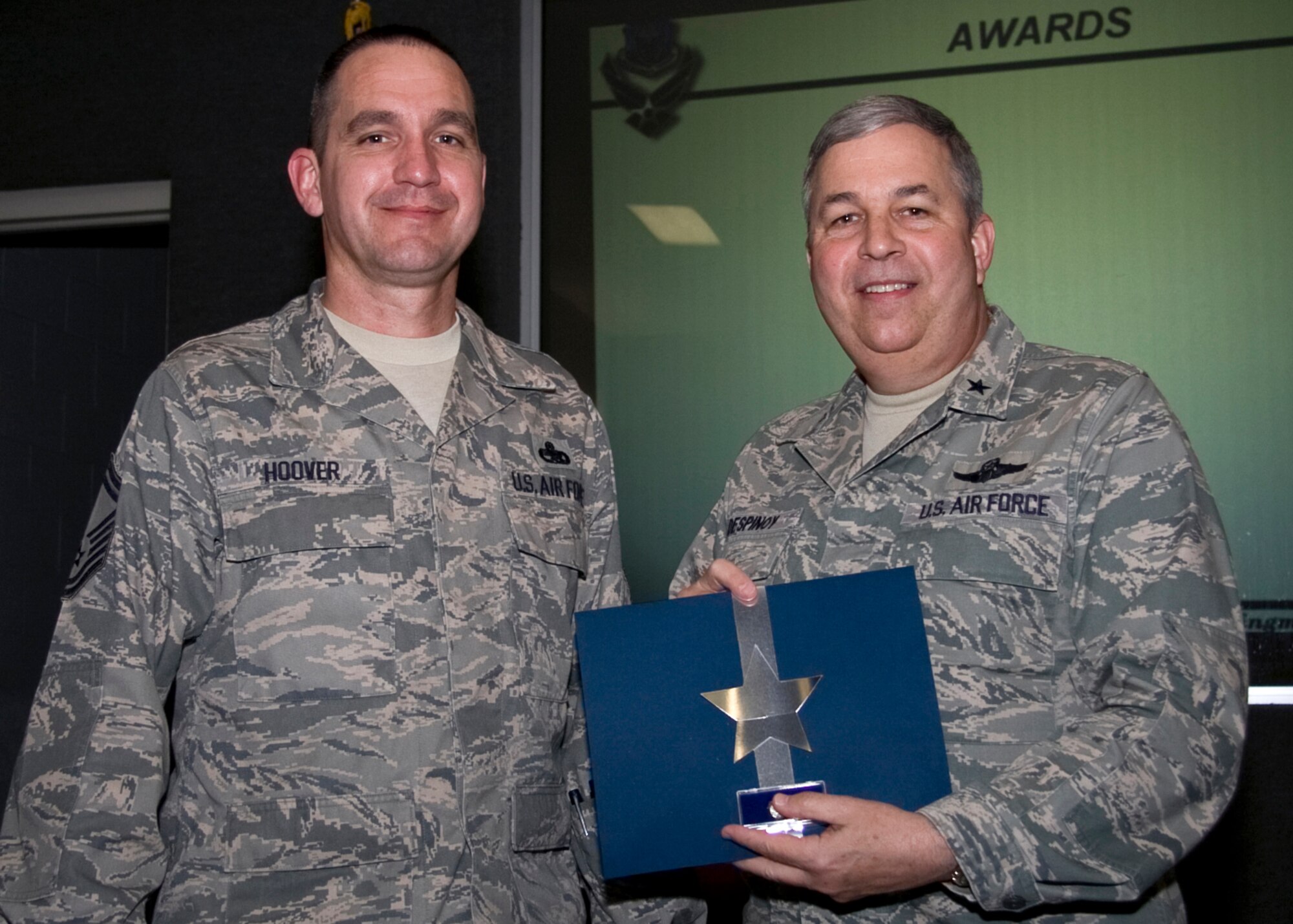 GRISSOM AIR RESERVE BASE, Ind. -- Senior Master Sgt. Charles Hoover is recognized for 20 years of federal service by Brig. Gen. Dean Despinoy.  Sergeant Hoover, a flight chief with the 434th Aircraft Maintenance Squadron, is an air reserve technician.  (U.S. Air Force photo/Tech. Sgt. Mark R. W. Orders-Woempner)