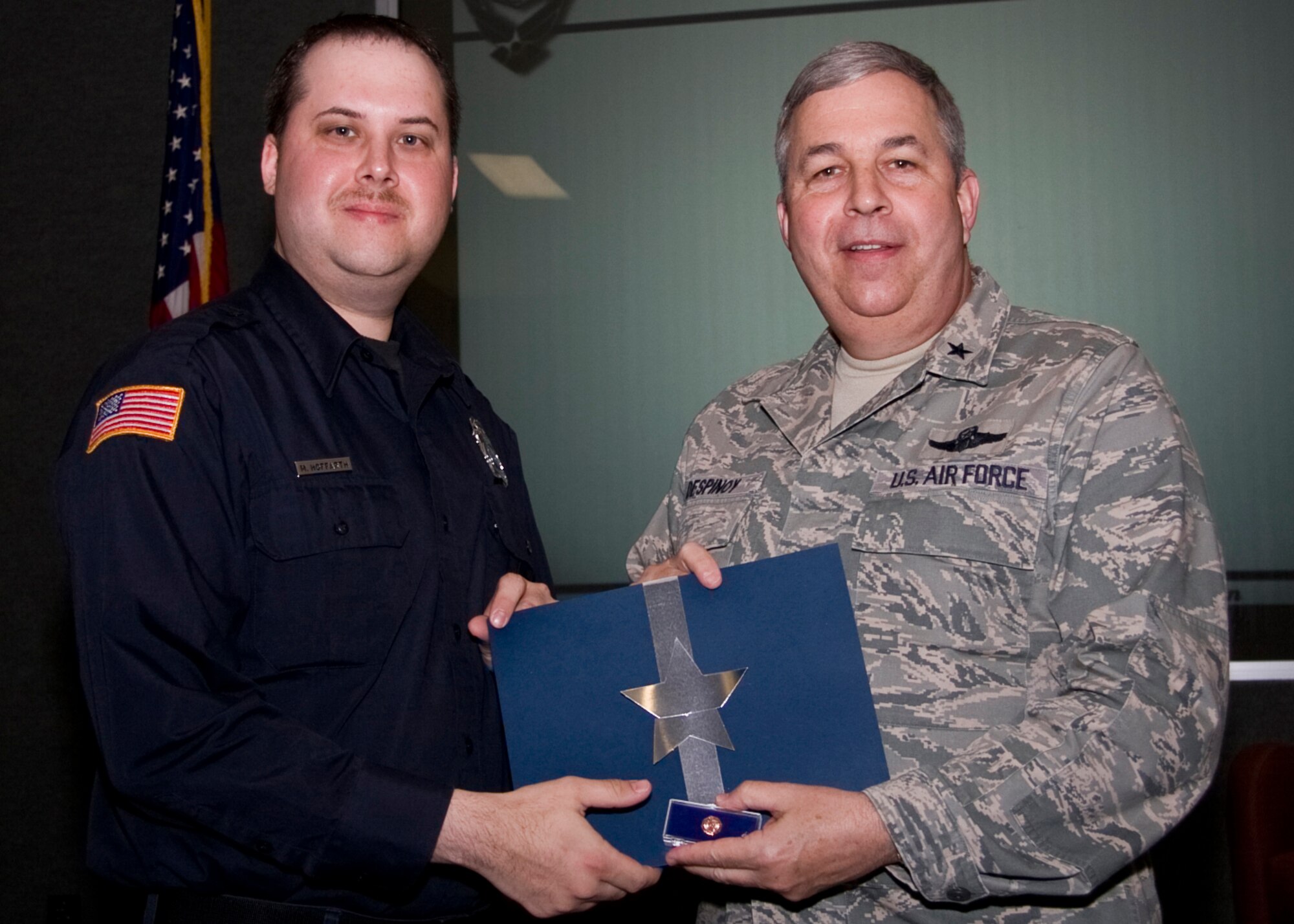 GRISSOM AIR RESERVE BASE, Ind. -- Michael Hoffarth, a Department of Defense police officer, poses for a photo with Brig. Gen. Dean Despinoy after being recognized for 10 years of federal service. (U.S. Air Force photo/Tech. Sgt. Mark R. W. Orders-Woempner)