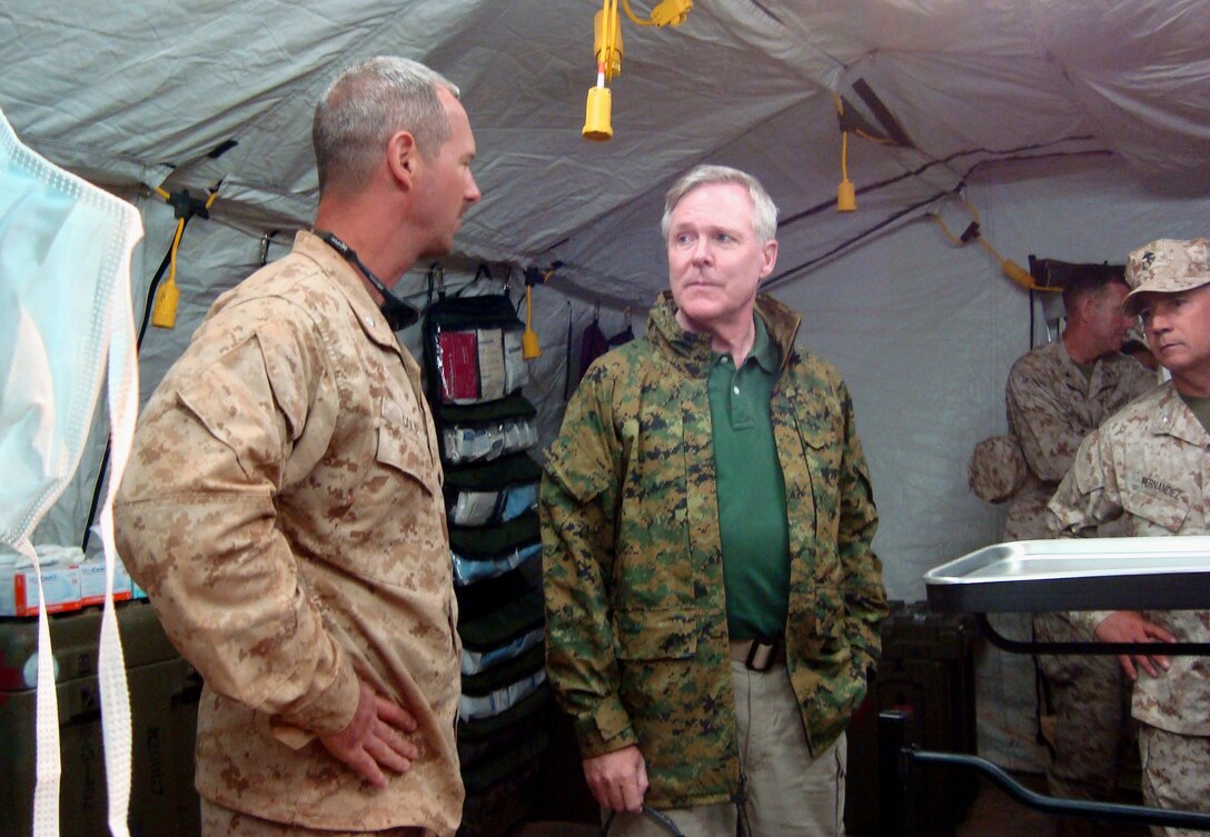 Cdr. James Cole [LEFT], a Navy reservist and trauma surgeon from Detachment 5 of Surgical Company A, 4th Medical Battalion, 4th Marine Logistics Group in Chicago briefs the Honorable Ray Mabus, Secretary of the U.S. Navy, during Mabus' visit to Cole's Forward Resuscitative Surgical Suite here June 5.  The FRSS provided emergency medical support to U.S. forces at African Lion 2010, a Marine Corps Forces Africa-led theater security cooperation exercise conducted annually with Moroccan forces.