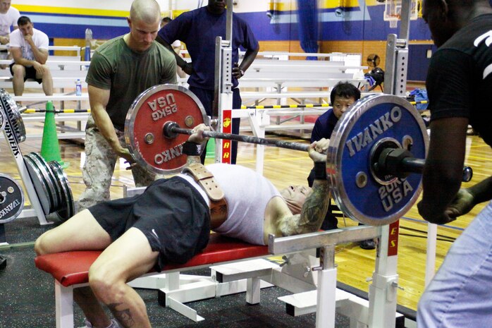Adrian Figueroa bench press competitor, attempts to lift 260 pounds during the 2010 Summer Slam Bench Press Competition at the IronWorks Gym here June 5. The amount of weight was left to be determined by the individual competitors according to their own abilities and personal goals. The lift only counted toward their combined total weight if competitors were able to fully extend their arms during the lift.