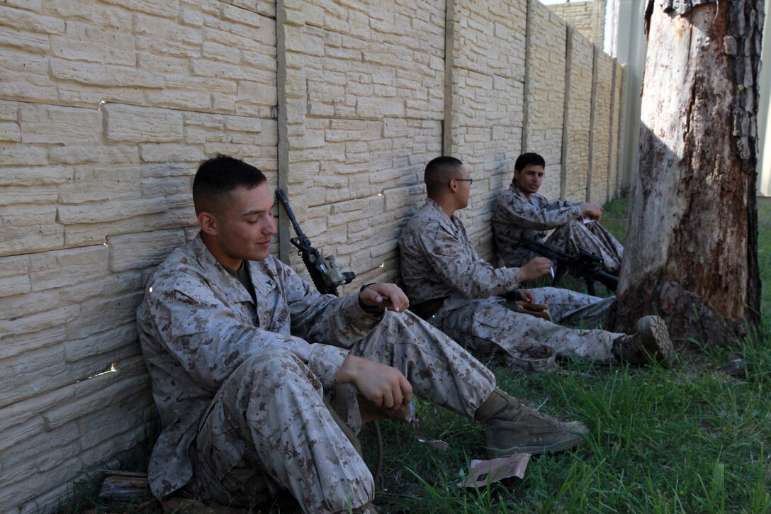 Lance Cpl. Dallin W. Jaramillo, a radio operator, with 1st Squad, 2nd Platoon, Lima Company, 3rd Battalion, 9th Marine Regiment,  2nd Marine Division, takes a lunch break after posting security during an exercise with role-playing Afghans April 16. Jaramillo a Denver, Colo., native is practicing key leader engagements and patrolling to help prepare for an upcoming deployment to Afghanistan. After the deployment Jaramillo plans to try out for the Bulldogs, a semi-pro football team aboard Marine Corps Base Camp Lejeune. Jaramillo plans on trying out for the middle linebacker position. (Official U.S. Marine Corps photo by Cpl. Walter D. Marino II)