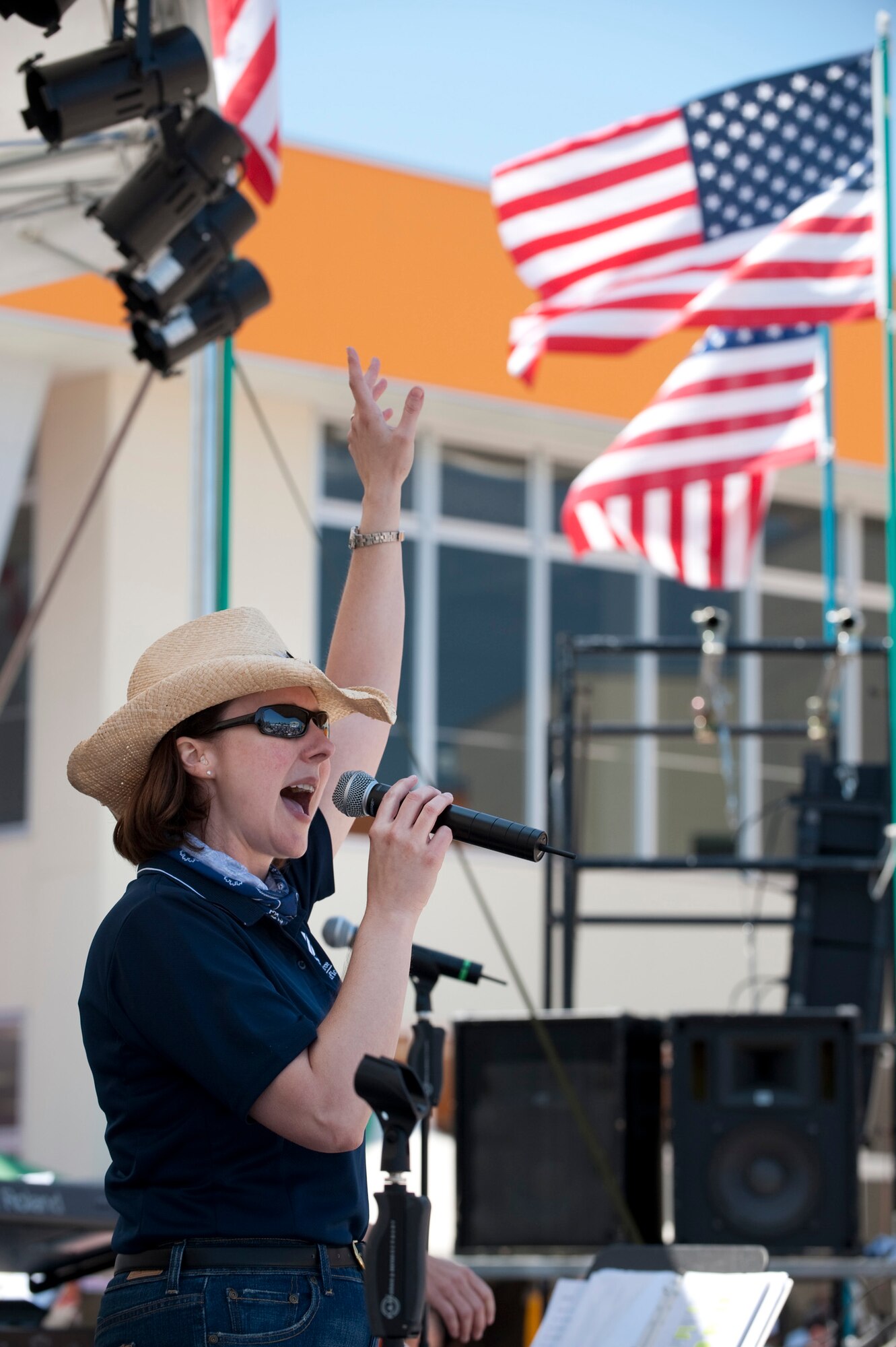 MISAWA CITY, Japan -- Tech. Sgt. Paula Goetz, Pacific Trends alto, sings a high note at American Park during American Day, June 6. Pacific Trends is a rock ensemble from the U.S. Air Forces Band of the Pacific - Asia at Yokota Air Base. (U.S. Air Force photo/Staff Sgt. Samuel Morse)