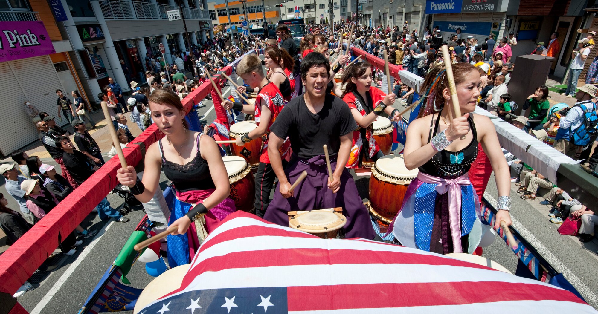MISAWA CITY, Japan -- The Dragon Eagle Taiko team plays on a float in the American Day Parade June 6. The team is mostly American, taught by Kazuko Igarashi, a native of northern Japan. (U.S. Air Force photo/Staff Sgt. Samuel Morse)