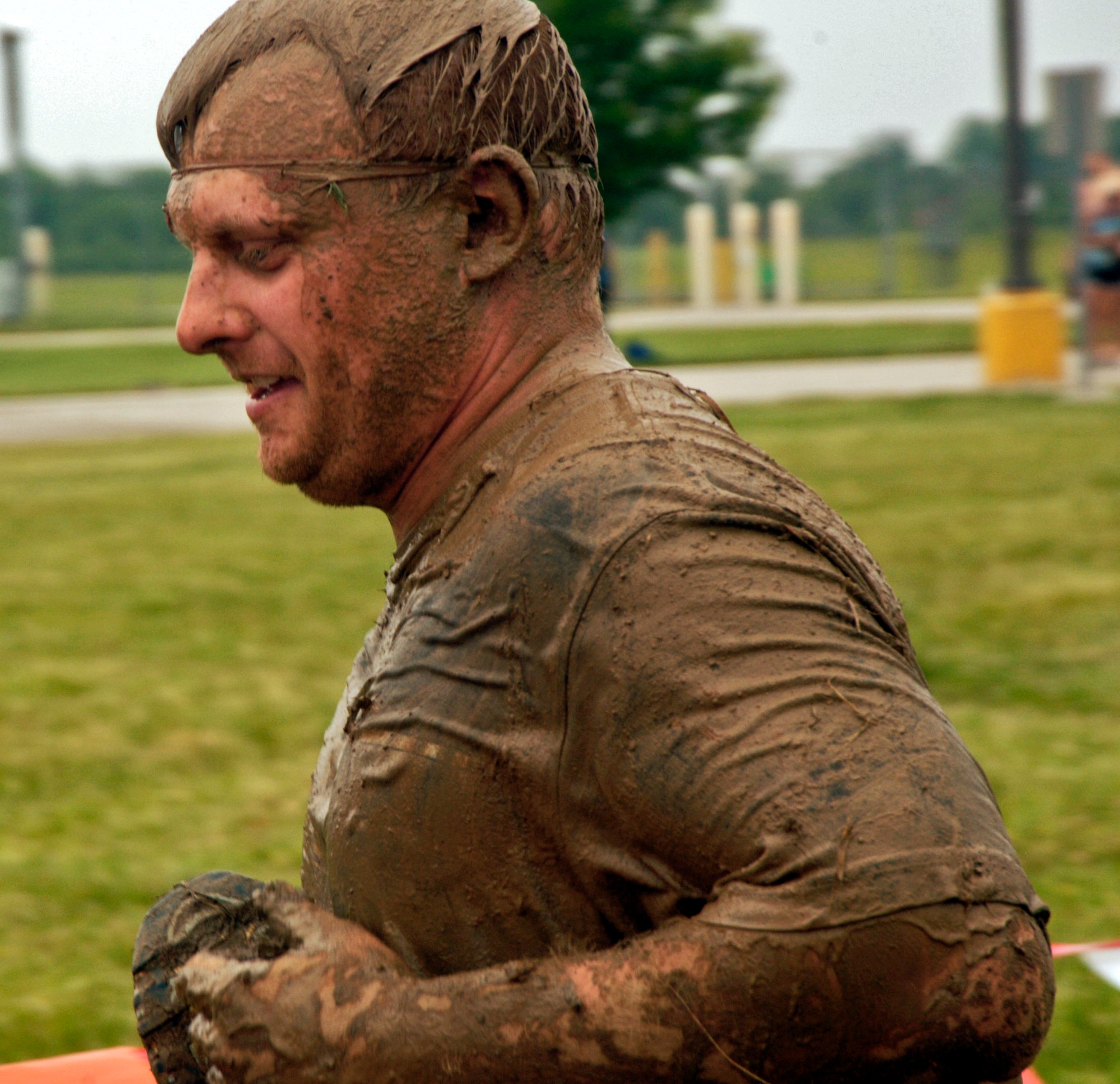 More than 1,000 runners ran through a 3.2 mile course of muck, mud and hay during the second annual USO Mud Run at Mid-America Airport June 5, 2010. Members of Scott's 375th Civil Engineering Squadron helped construct the course and ensured its "mudworthiness" and numerous base volunteers assisted with the event. (Photo by Karen Petitt/375th AMW/PA)