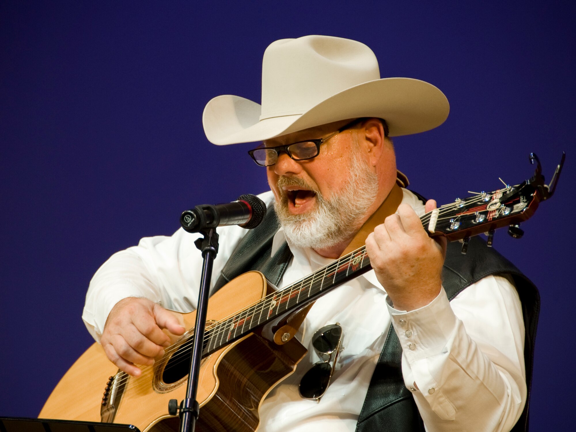 MISAWA CITY, Japan -- Bryan Perdue, 35th Civil Engineer Squadron base planner, performs a rendition of Elvis Presley's American Trilogy during the 22nd Annual American Day festival June 6 at the Misawa Civic Center. In his first time performing during American Day, Mr. Perdue played folk, country and classical guitar music. (U.S. Air Force photo/Senior Airman Jamal D. Sutter)