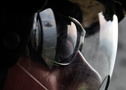 Army Sergeant Devon Nier, 1st Battalion, 228th Aviation Regiment from Soto Cano Air Base, Honduras, watches a UH-60 Blackhawk June 6 during disaster relief efforts following the Pacaya Volcano eruption and Tropical Storm Agatha in Guatemala. The 1/228th, along with other members of Joint Task Force-Bravo, deployed June 1 and have transported approximately 152,000 pounds of relief supplies to 14 Guatemalan communities in need. (U.S. Air Force photo by Staff Sgt. Bryan Franks)