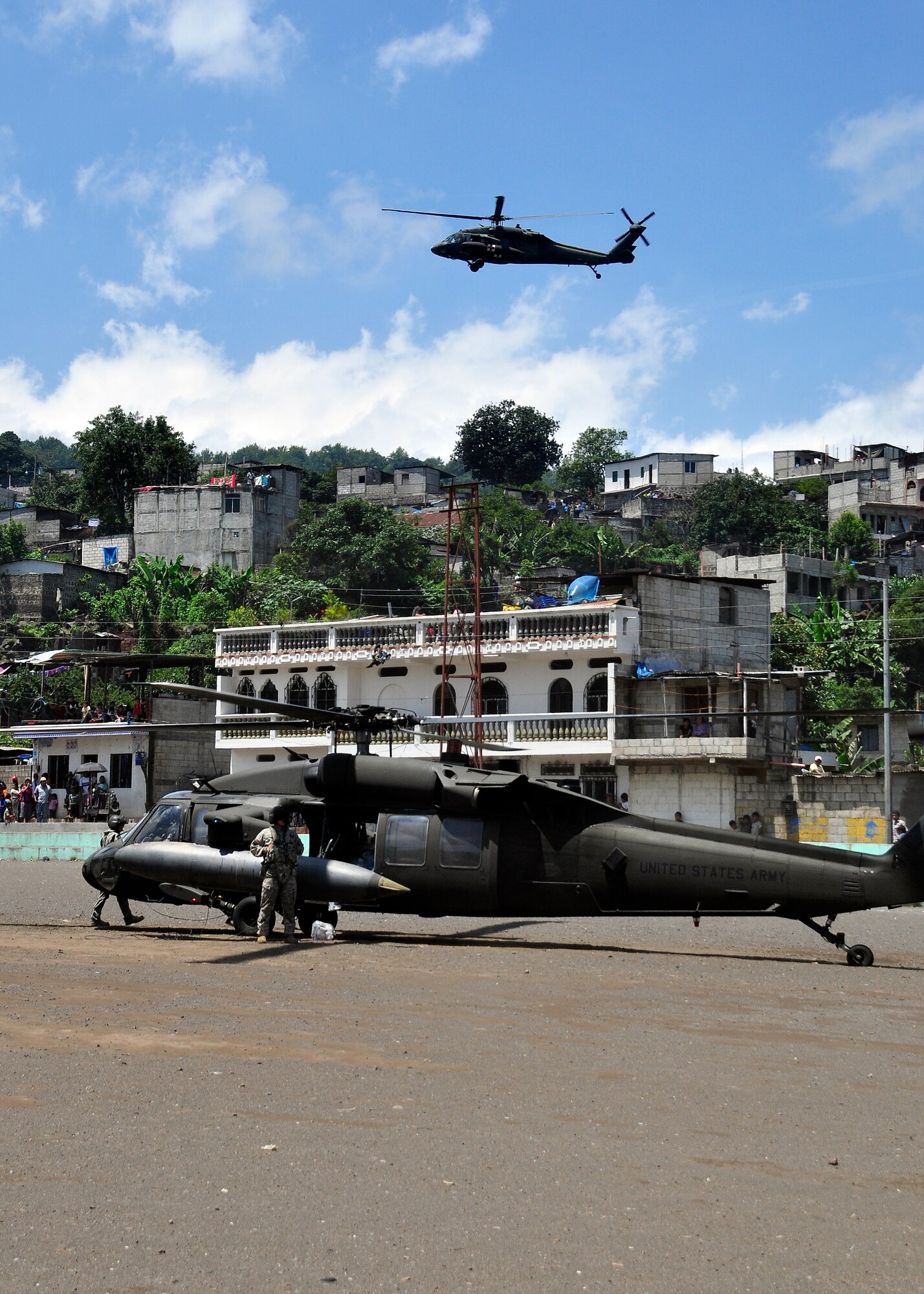 Joint Task Force-Bravo's UH-60 Blackhawks delivered disaster relief supplies to the citizens of Santiago Atitlan, Guatemala June 6 at the request of the Guatemalan government, in support of disaster relief efforts following the Pacaya Volcano eruption and Tropical Storm Agatha. Joint Task Force-Bravo helicopters deployed June 1 and have transported approximately 152,000 pounds of relief supplies to 14 Guatemalan communities in need. (U.S. Air Force photo by Staff Sgt. Bryan Franks)