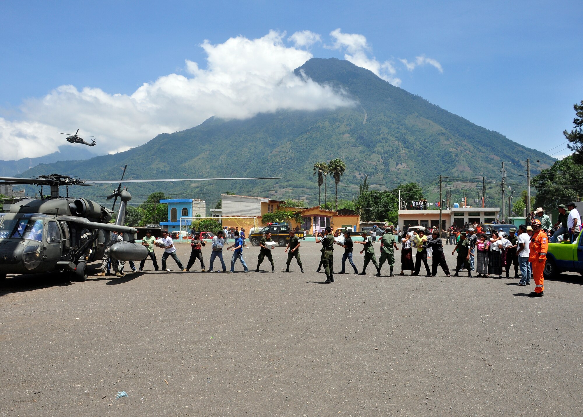 Joint Task Force-Bravo's UH-60 Blackhawks delivered disaster relief supplies to the citizens of Santiago Atitlan, Guatemala June 6 at the request of the Guatemalan government, in support of disaster relief efforts following the Pacaya Volcano eruption and Tropical Storm Agatha. Joint Task Force-Bravo helicopters deployed June 1 and have transported approximately 152,000 pounds of relief supplies to 14 Guatemalan communities in need. (U.S. Air Force photo by Staff Sgt. Bryan Franks)