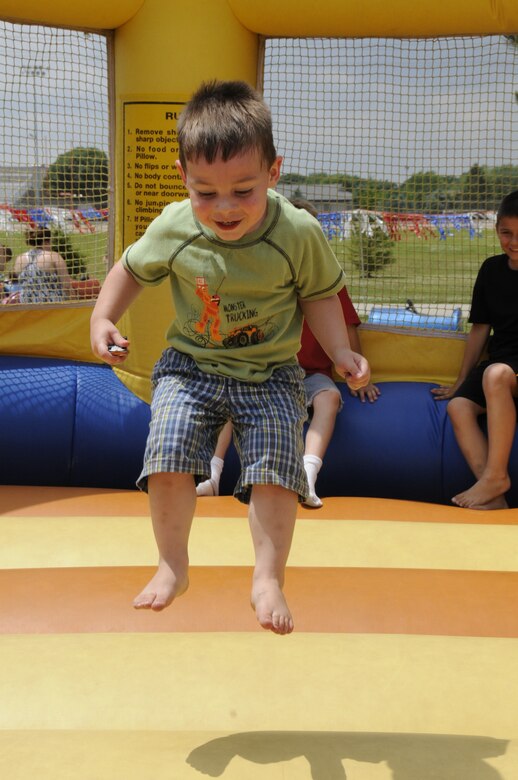 Kaden Baker, son of Tech. Sergeant Shane Baker, plays on the bouncing castle at the annual 185th Family Fun Day in, Sgt. Bluff, Iowa, on June 5th, 2010.