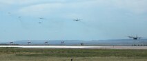 Six An Air Force Reserve C-130 Hercules depart one by one June 5 from Peterson Air Force Base, Colo., as part of a multi-ship training exercise. After performing practice air drops over eastern Colorado, each of the aircraft joined together for a multi-ship formation flight over the base. Later, the six C-130s simulated tactical air drops at the Red Devil tactical airstrip at nearby Ft. Carson. Typically, C-130 wings in the AF Reserve only fly in multi-ship formations once or twice a year to simulate combat conditions while flying in close formation. Five of the C-130 aircrews are assigned to the 302nd Airlift Wing at Peterson AFB, which included both AF Reserve and Active Duty Airmen. The final aircrew was assigned to the 94th Airlift Wing, based at Dobbins Air Reserve Base outside of Atlanta. (U.S. Air Force photo/Tech. Sgt. Daniel Butterfield)