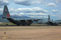 An Air Force Reserve C-130 Hercules multi-ship formation prepares to take-off June 5 from Peterson Air Force Base, Colo. After performing practice air drops over eastern Colorado, each of the aircraft joined together for a multi-ship formation flight over the base. Later, the six C-130s simulated tactical air drops at the Red Devil tactical airstrip at nearby Ft. Carson. Typically, C-130 wings in the AF Reserve only fly in multi-ship formations once or twice a year to simulate combat conditions while flying in close formation. Five of the C-130 aircrews are assigned to the 302nd Airlift Wing at Peterson AFB, which included both AF Reserve and Active Duty Airmen. The final aircraft and aircrew were assigned to the 94th Airlift Wing, based at Dobbins Air Reserve Base outside of Atlanta. (U.S. Air Force photo/Tech. Sgt. Daniel Butterfield)